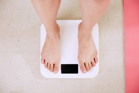Feet standing on weight scale
