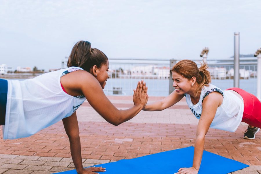 Two women doing push ups