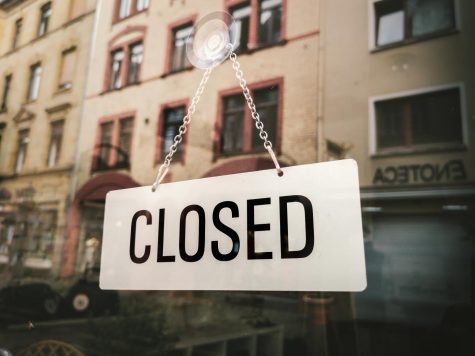 Closed sign in front of building