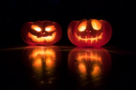 Carved pumpkins lit up at night