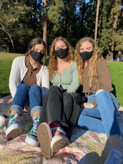 Three masked female students