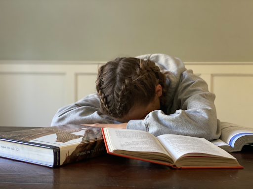 Female student with head on desk