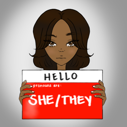 Girl holding she/they name tag