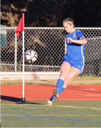 Acalanes girls soccer captain Tatum Zuber makes a corner kick in a recent match.