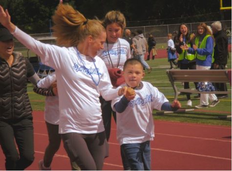 Springhill Elementary athletes run a victory lap in the 2022 Special Olympics hosted at Acalanes High School.