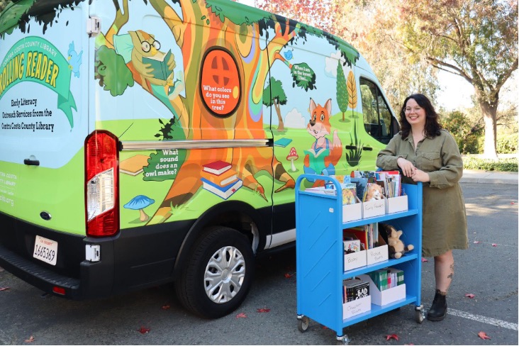 Bella Merrill is the early literacy outreach librarian for the Contra Costa County Library. She travels across the county in the library’s all-electric early literacy outreach van, the Rolling Reader, providing bilingual storytimes, STEM programs, and other learning experiences to children in historically underserved areas. Photo Credit: Contra Costa County Library