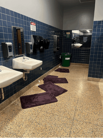 New rugs are now used near toilets and sinks to soak up excess water on a bathroom floor at Northgate High School in Walnut Creek.
