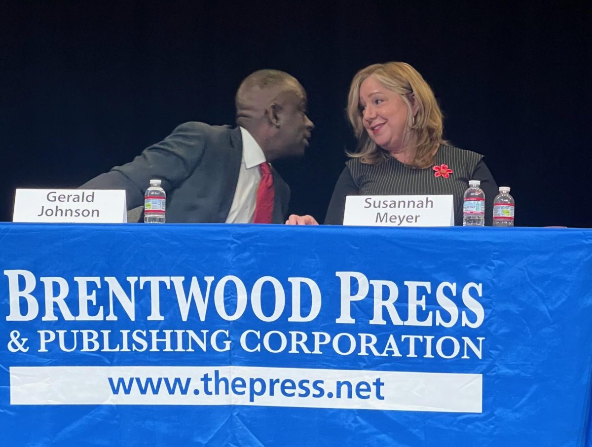 Brentwood mayoral candidates Gerald Johnson and Susannah Meyer share a moment during Oct. 14 forum held at   Bristow Middle School.