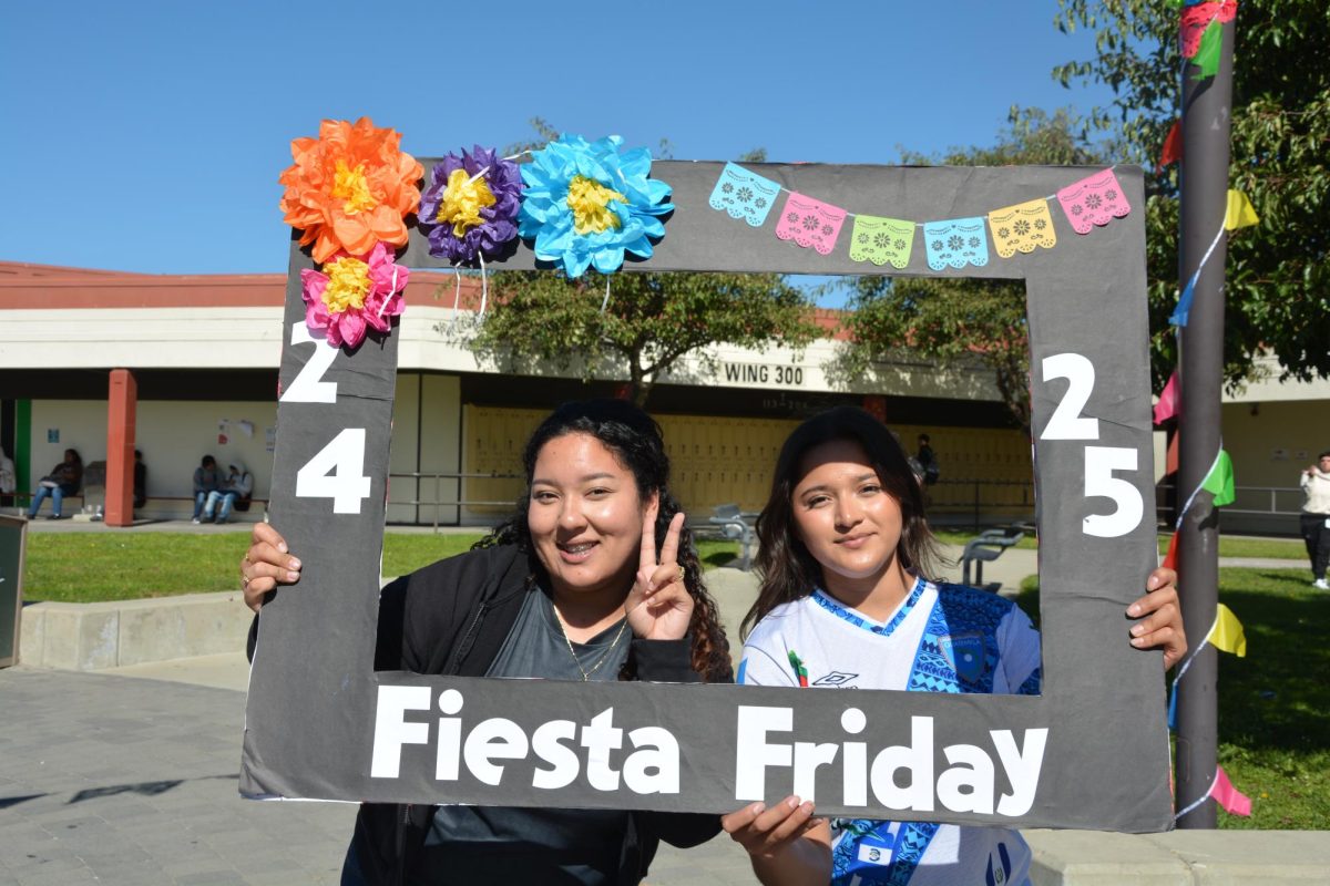 Jennifer Campos and Angelica Barrios, Kennedy High School 12th graders, get into the spirit of Fiesta Friday. Photo by 12th grader Asia Belcher
