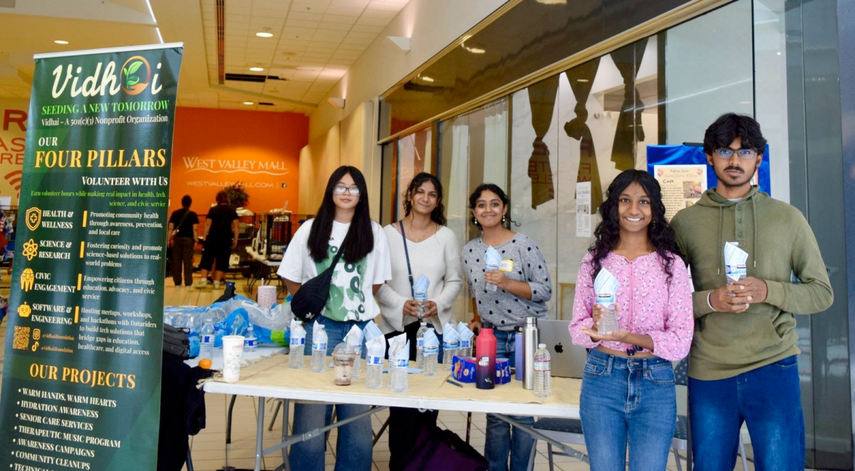 Vadhai Club members hand out water bottles at West Valley Mall in Tracy as part of a hydration awareness initiative. From left to right are Amy Rattanachuen, Riyana Sanof, Ishita Khanna, Sadhana Arivoli, and Saivignesh Narayanviswanathan. Club president Arivoli said after teachers began following work-to-rule hours to express dissatisfaction with contract negotiations, the club had problems holding meetings. 