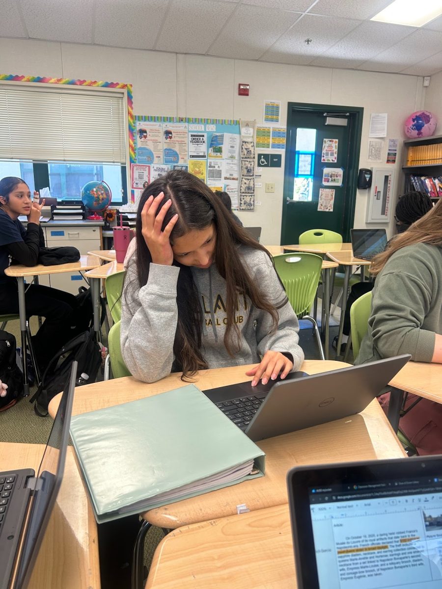 Desteney Zepeda-Balladares, an 11th grader at Dozier-Libbey Medical High School in Antioch, attempts to connect to Wi-Fi in class. 
